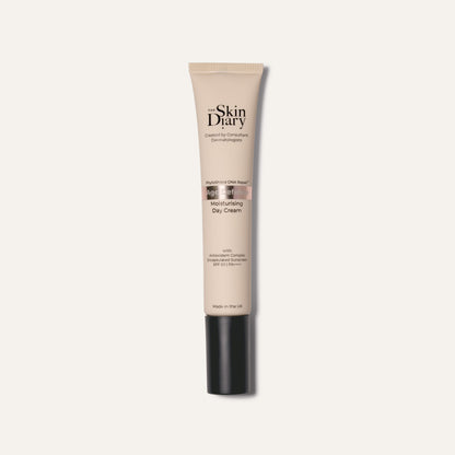 A tube of The Skin Diary Moisturising Day Cream on a clean white background. The tube is beige with a black cap, and the brand name 'The Skin Diary' is printed in black on the front.