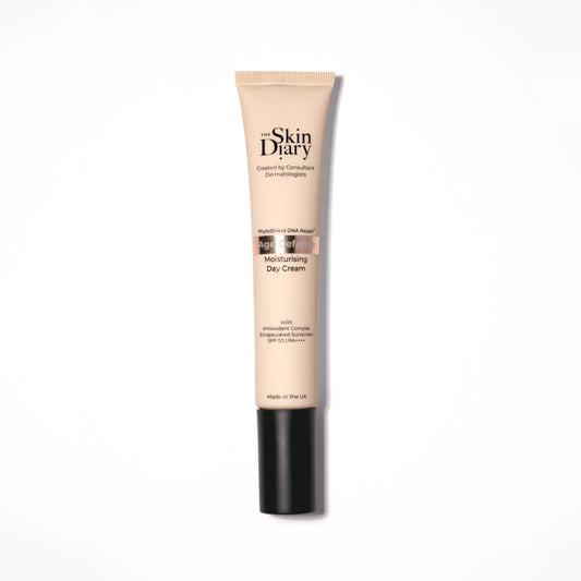 A tube of The Skin Diary Moisturising Day Cream on a clean white background. The tube is beige with a black cap, and the brand name 'The Skin Diary' is printed in black on the front.