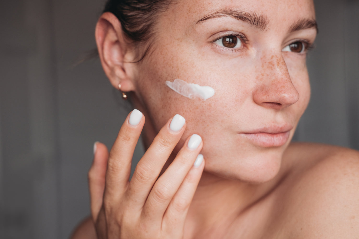 Woman applying cream